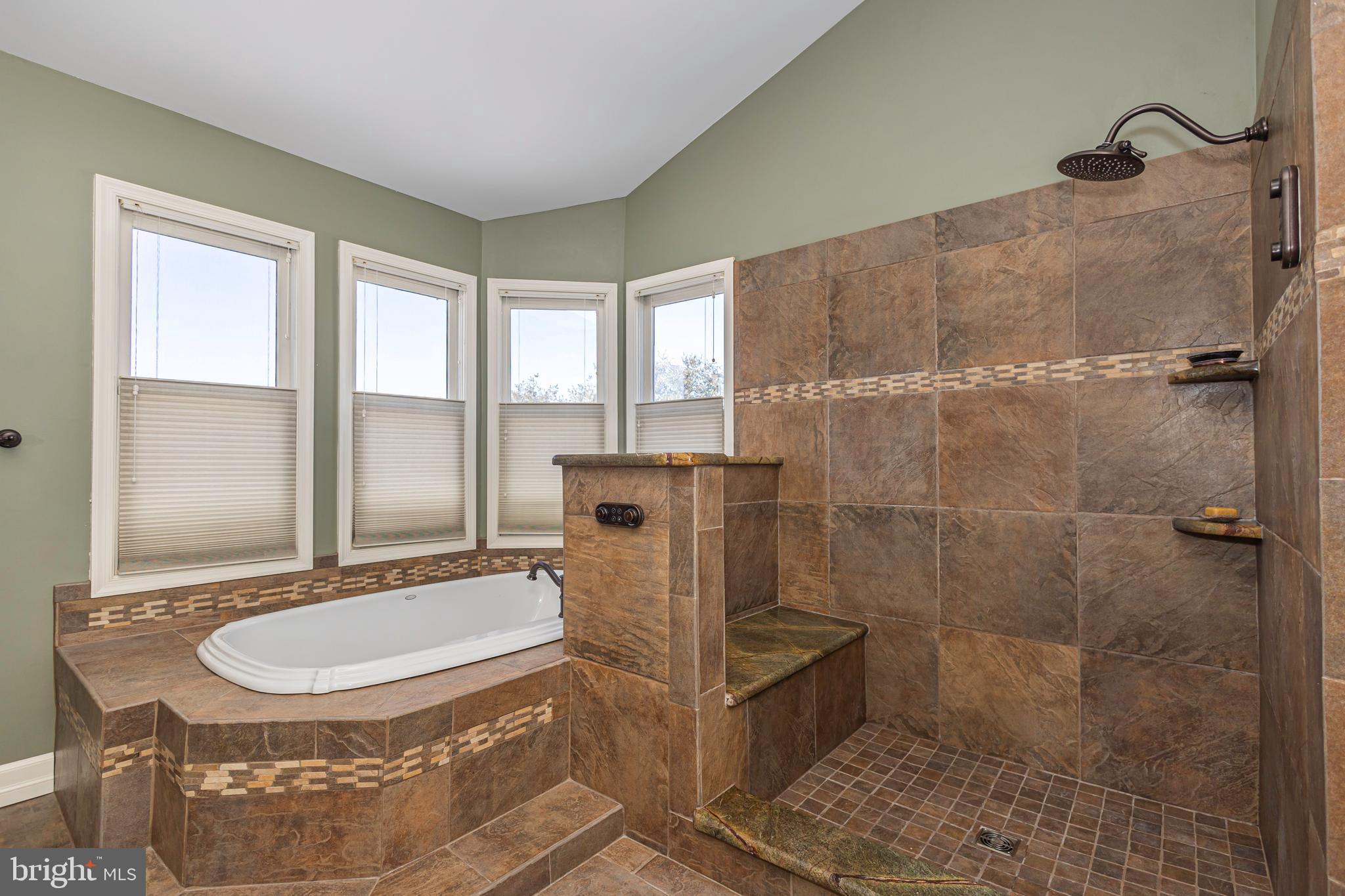 895 Slate Hill Road Yardley, PA 19067 - Photo 52 of 67 a bathroom with a granite countertop sink a mirror and a shower
