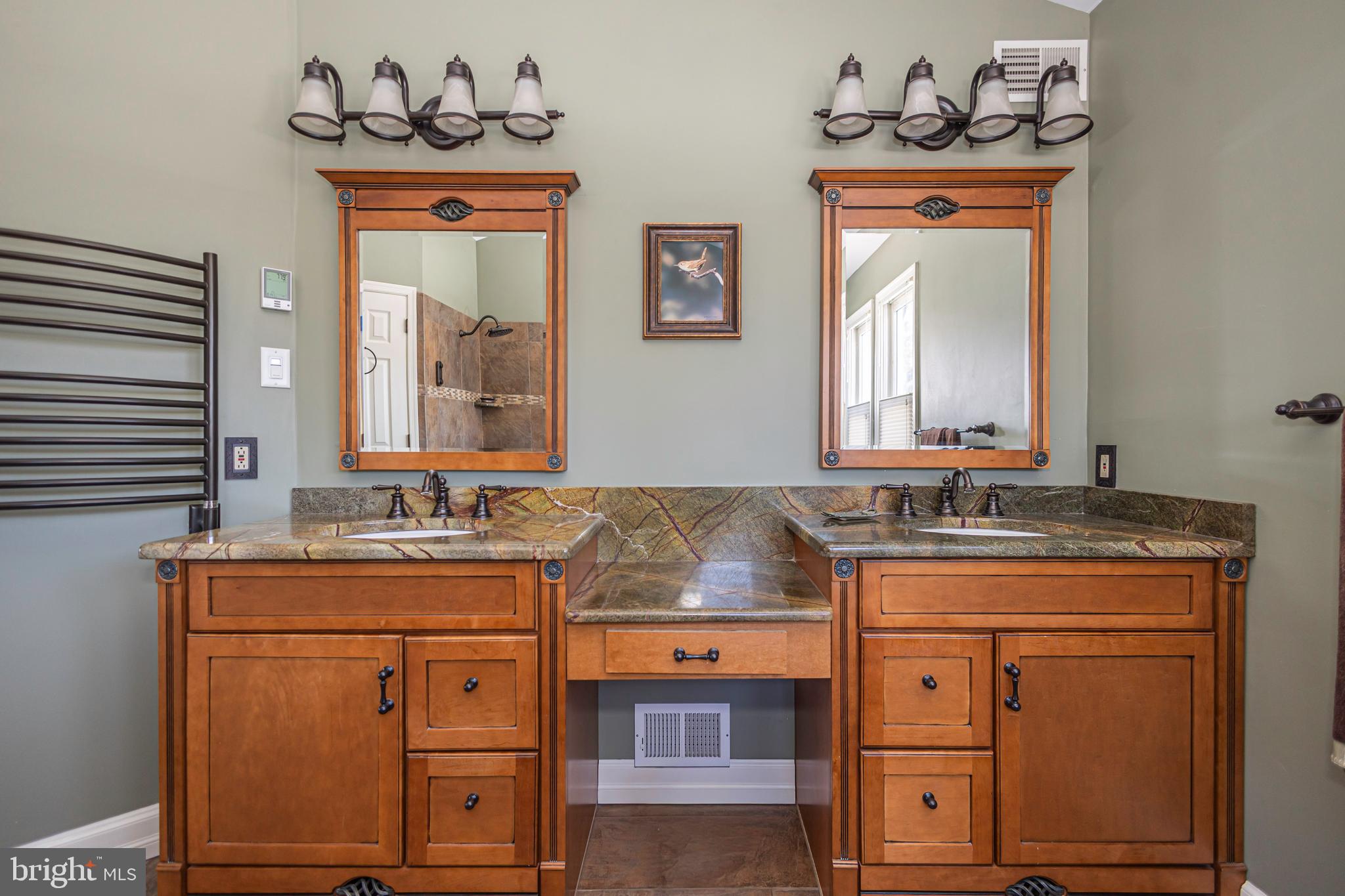 895 Slate Hill Road Yardley, PA 19067 - Photo 54 of 67 a bathroom with a sink and a mirror