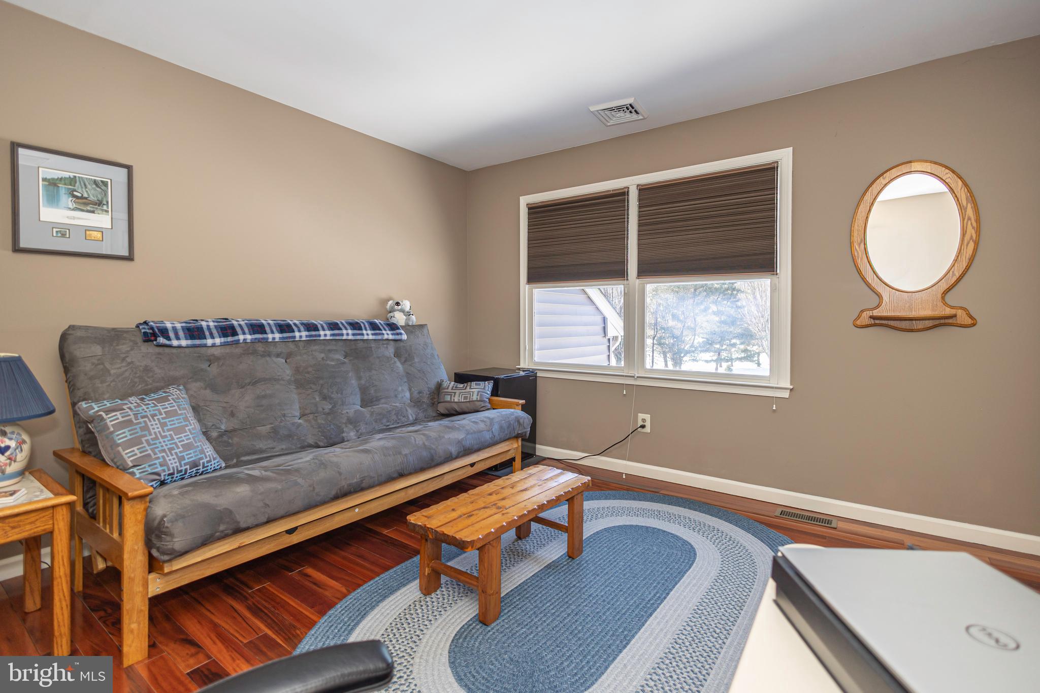 895 Slate Hill Road Yardley, PA 19067 - Photo 59 of 67 a living room with a couch and a window