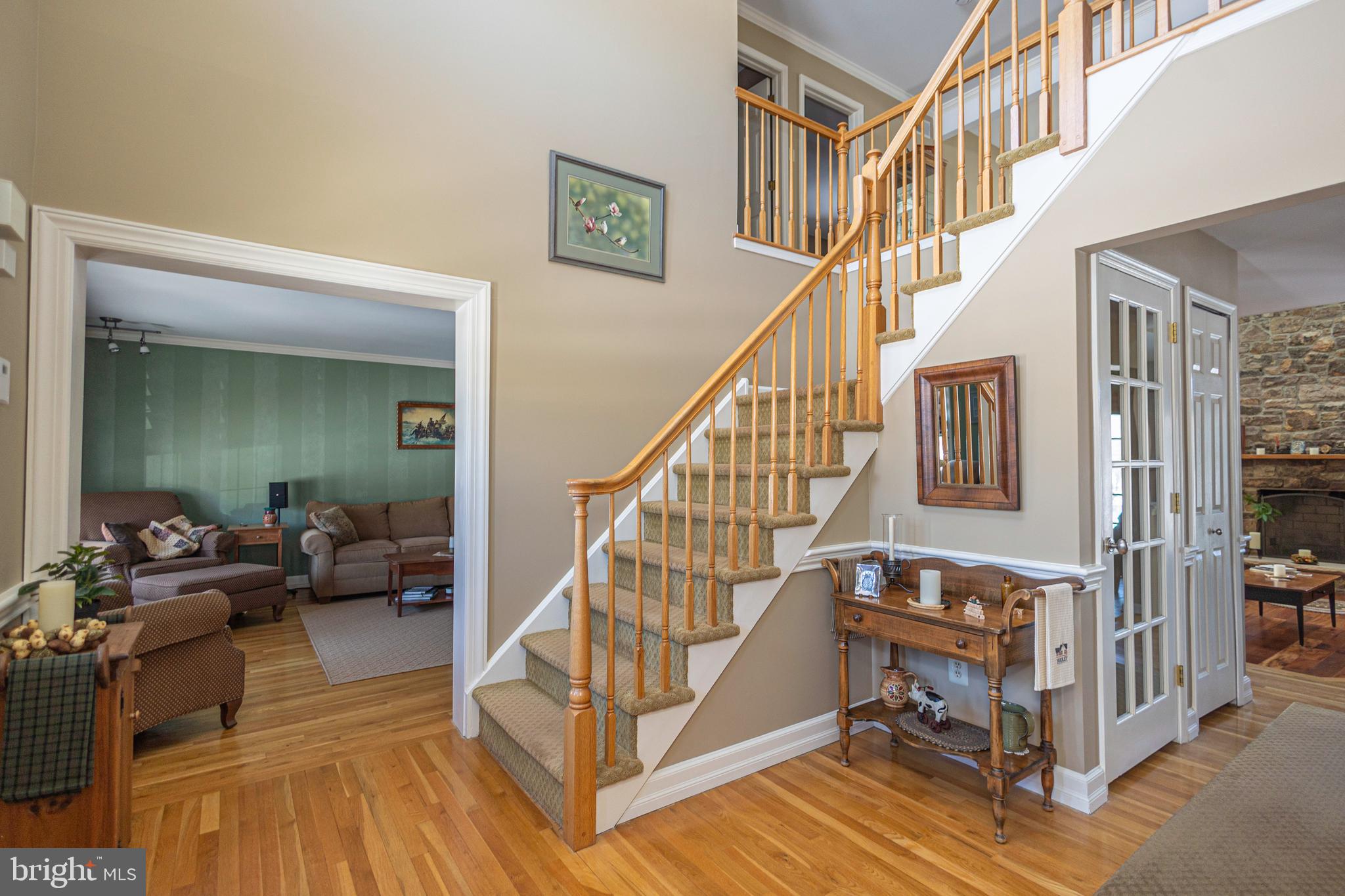 895 Slate Hill Road Yardley, PA 19067 - Photo 8 of 67 a view of entryway livingroom and hall with wooden floor