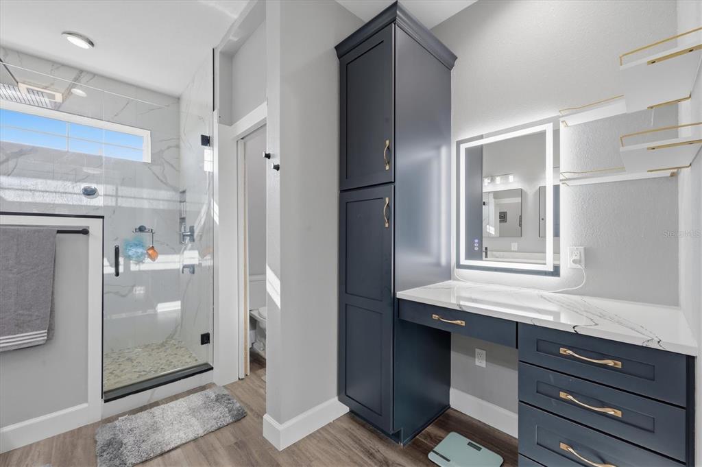 20 Brig Circle East Placida, FL 33946 - Photo 22 of 44 a bathroom with a sink a mirror and shower
