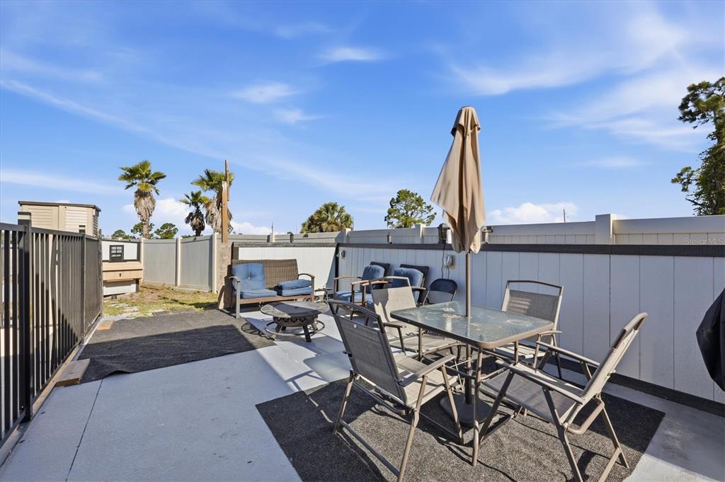 20 Brig Circle East Placida, FL 33946 - Photo 28 of 44 a view of a patio with table and chairs potted plants