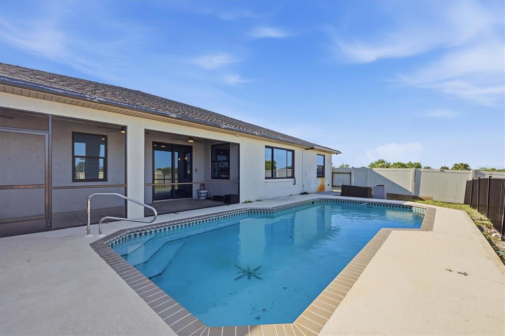 20 Brig Circle East Placida, FL 33946 - Photo 30 of 44 a view of a house with swimming pool and sitting area