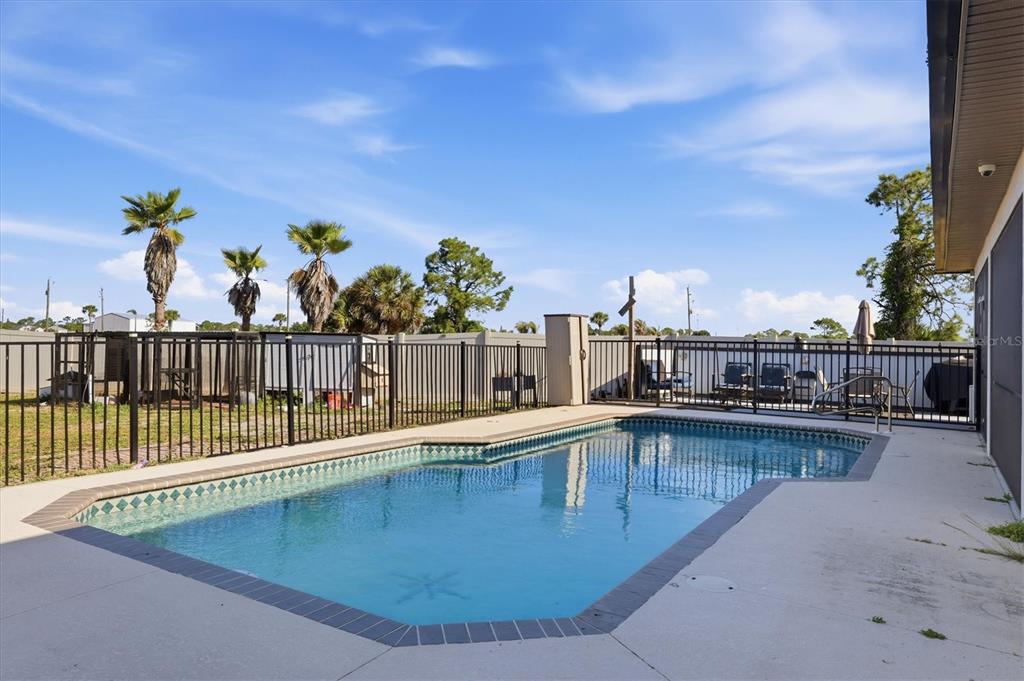 20 Brig Circle East Placida, FL 33946 - Photo 32 of 44 a view of a swimming pool with a lounge chair