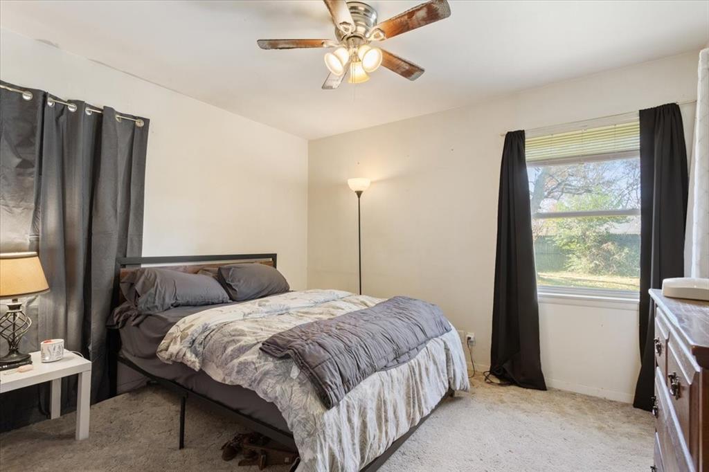 106 South Barbara Street Lacy-Lakeview, TX 76705 - Photo 14 of 27 a bedroom with a bed closet and a window
