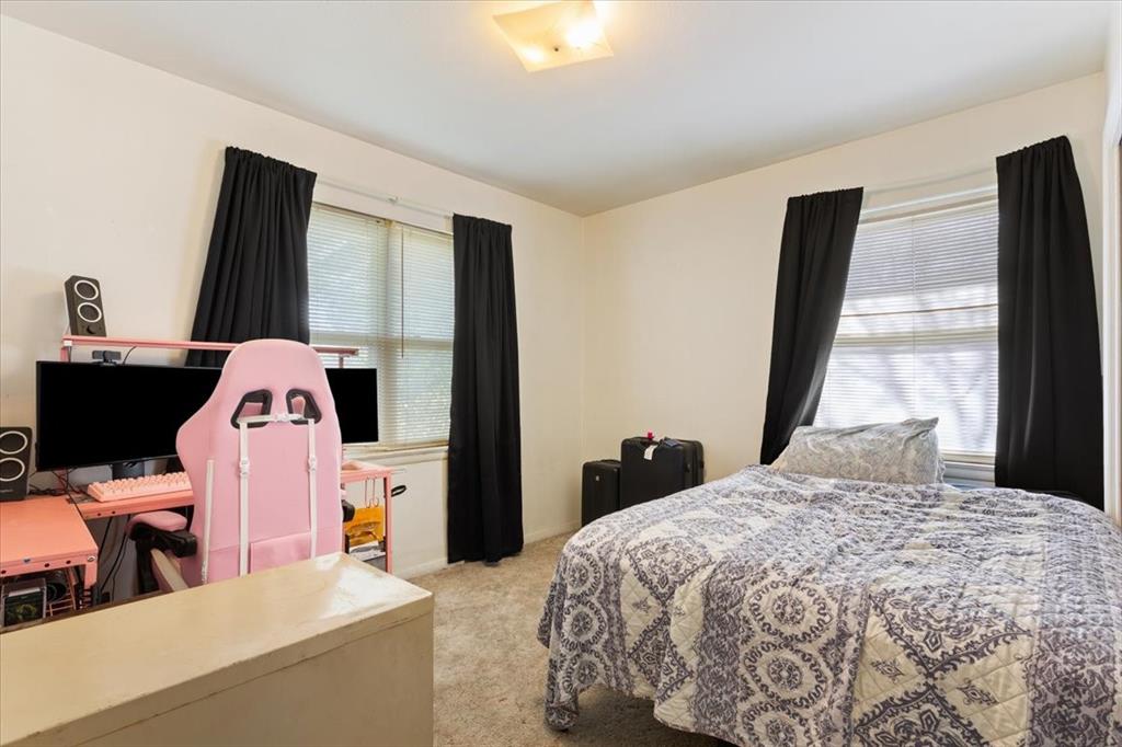 106 South Barbara Street Lacy-Lakeview, TX 76705 - Photo 16 of 27 a bedroom with a bed and a flat tv screen