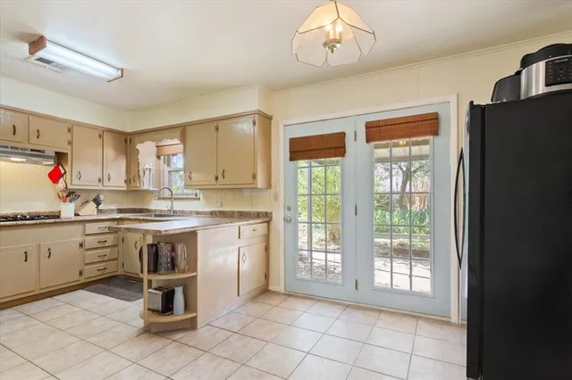 a kitchen with a sink and cabinets