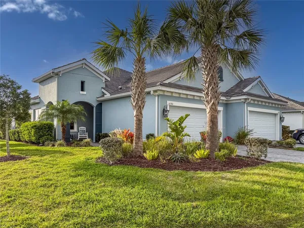 a front view of house with yard and seating space