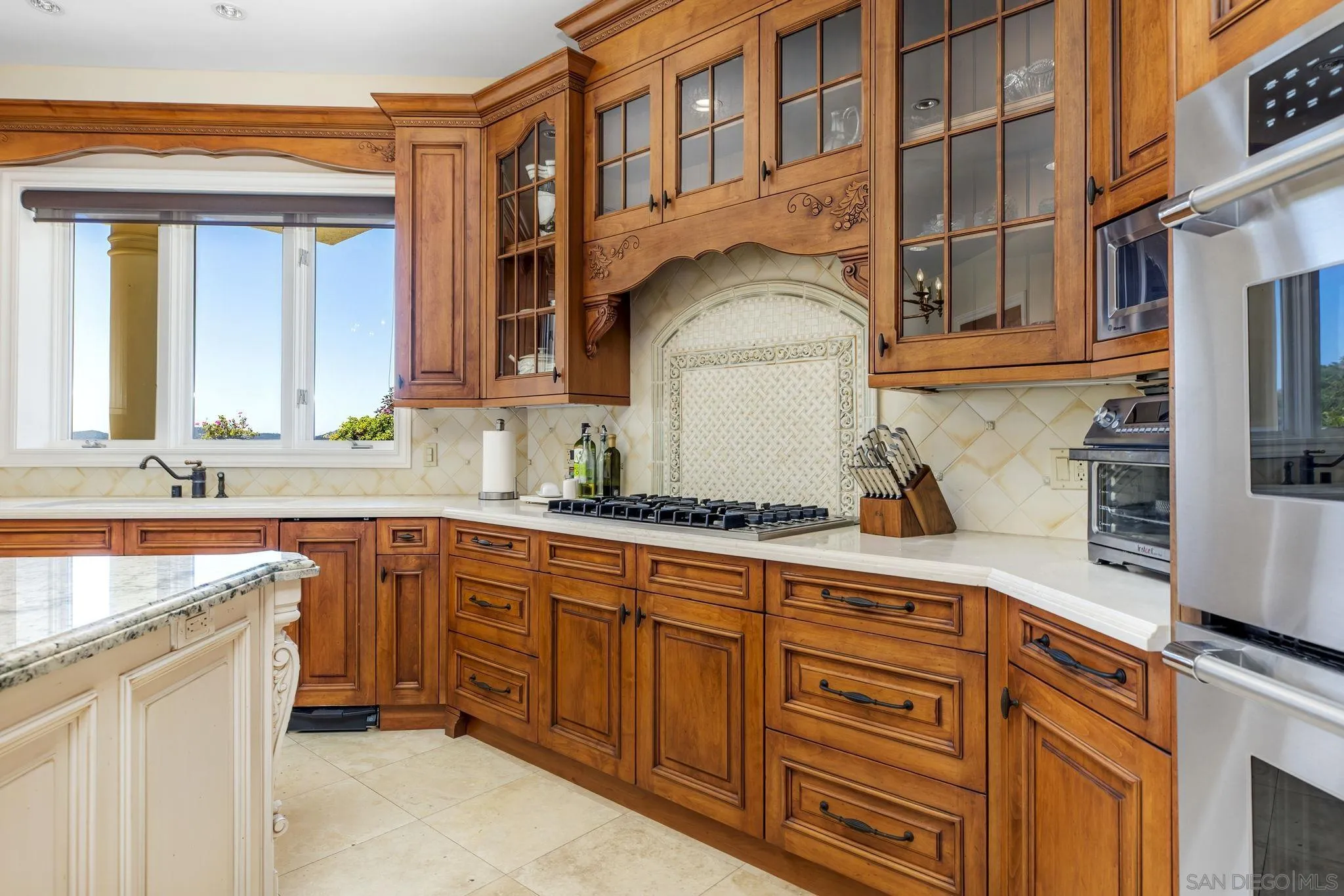 14440 Ridge Ranch Road Valley Center, CA 92082 - Photo 37 of 73 a kitchen with stainless steel appliances granite countertop a sink and cabinets