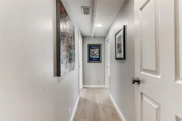 a view of a bathroom with a shower and a sink