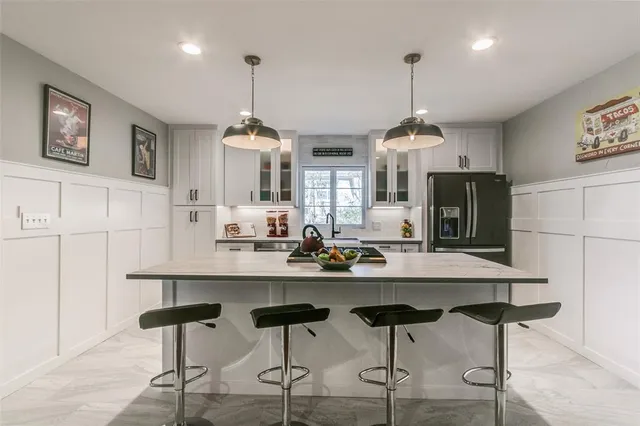 a living room with furniture a fireplace and a table