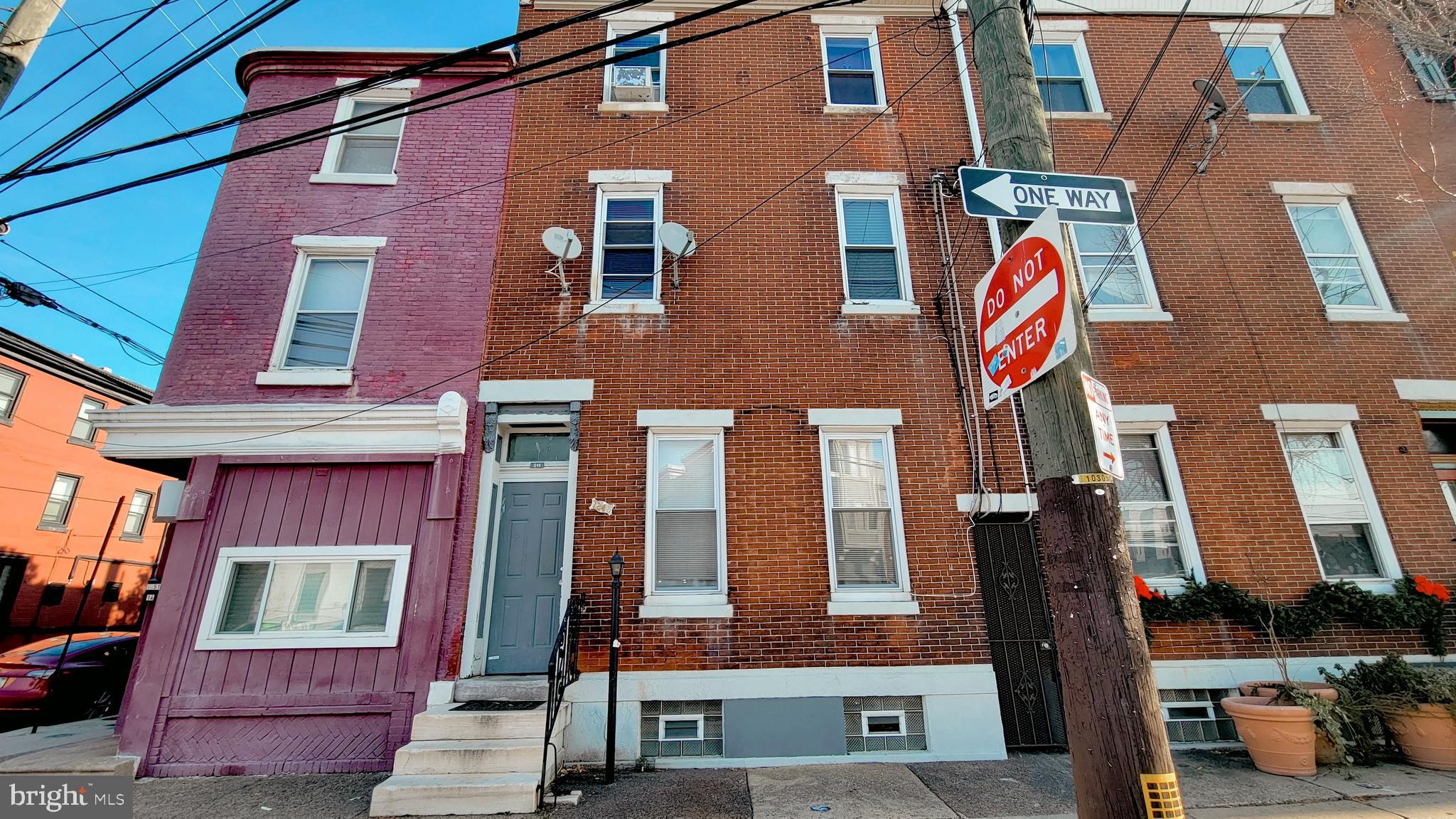 1249 Shackamaxon Street, Unit 2F Philadelphia, PA 19125 - Photo 1 of 9 a front view of a building with multiple windows