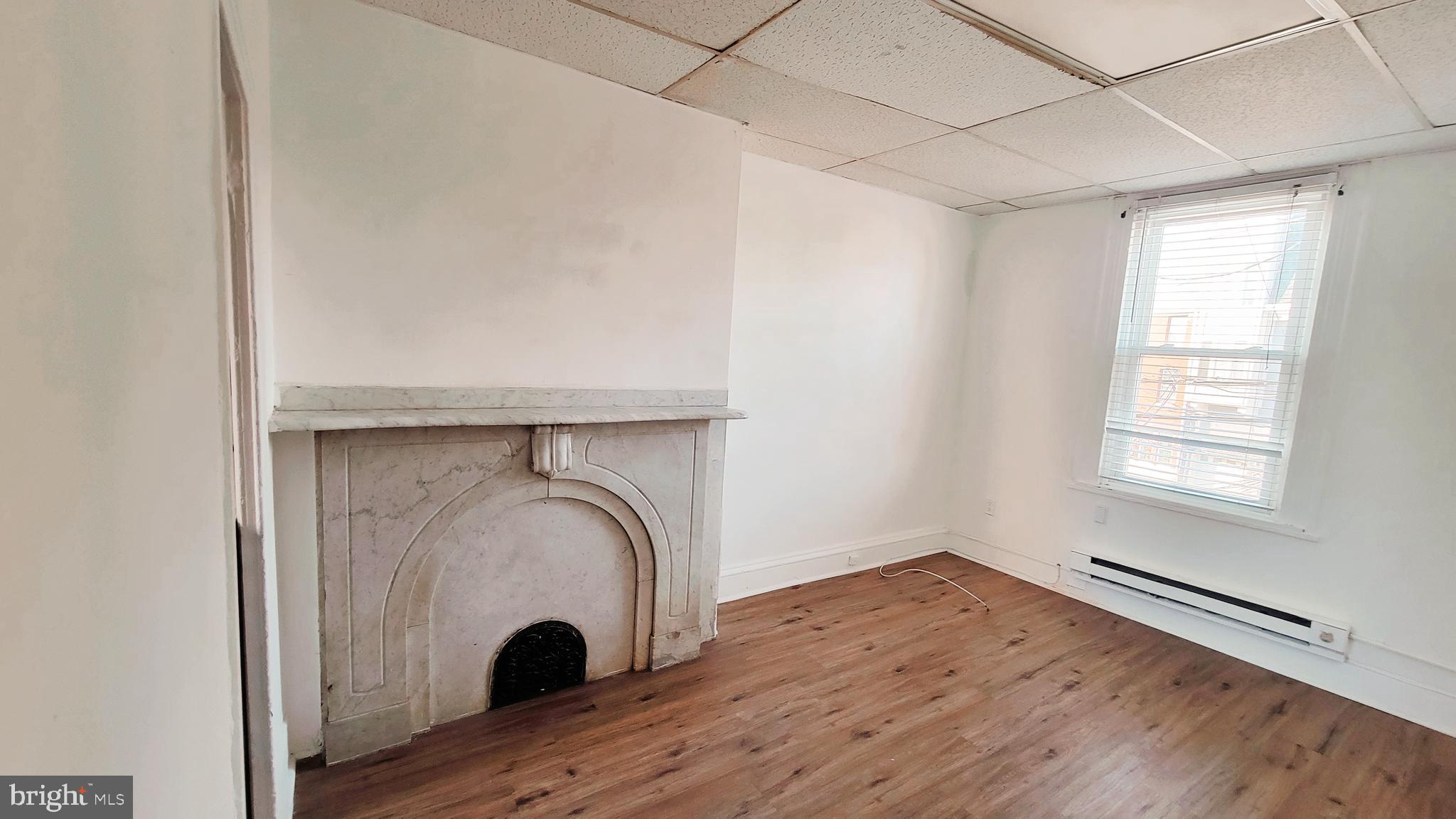 1249 Shackamaxon Street, Unit 2F Philadelphia, PA 19125 - Photo 4 of 9 a view of space window and wooden floor