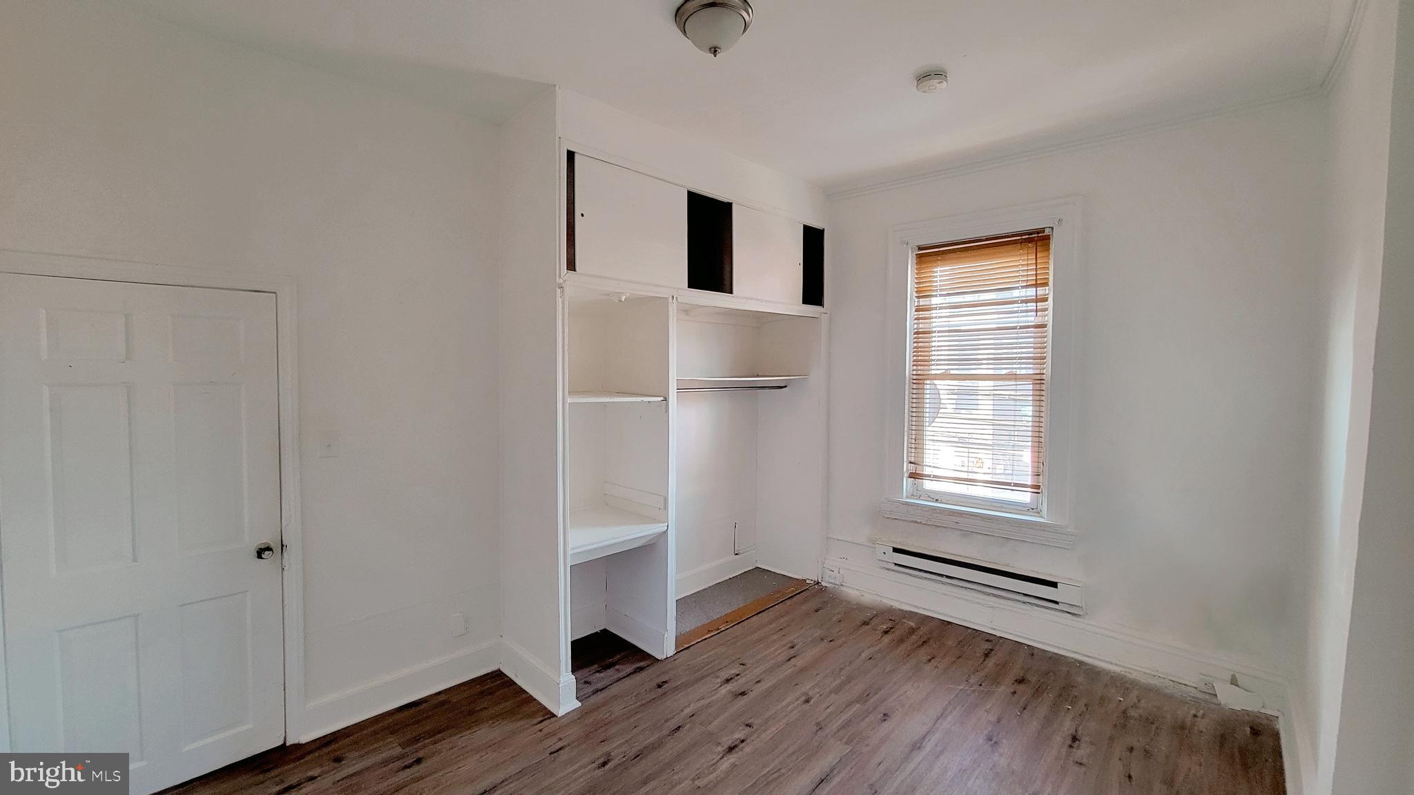 1249 Shackamaxon Street, Unit 2F Philadelphia, PA 19125 - Photo 5 of 9 a view of livingroom with hardwood floor and window