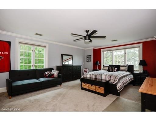 13 Snow Fields Road Mattapoisett, MA 02739 - Photo 18 of 24 a spacious bedroom with a bed couch and window
