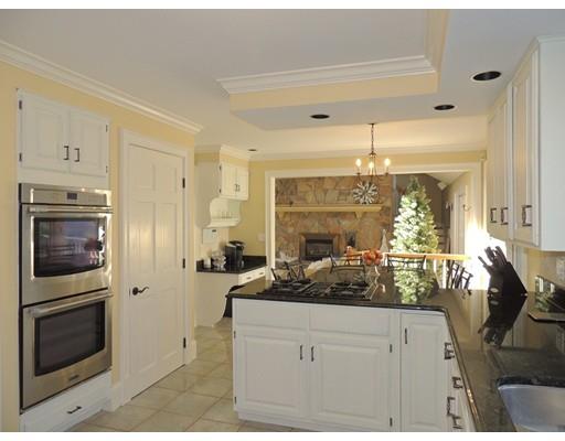 13 Snow Fields Road Mattapoisett, MA 02739 - Photo 7 of 24 a kitchen with stainless steel appliances a stove refrigerator and cabinets