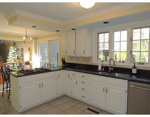 13 Snow Fields Road Mattapoisett, MA 02739 - Photo 8 of 24 a kitchen with granite countertop white cabinets white appliances and a sink