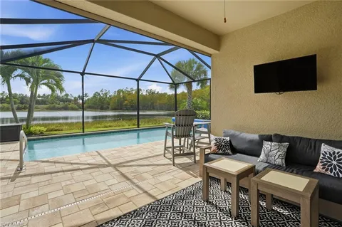 a view of a chairs and table in the patio