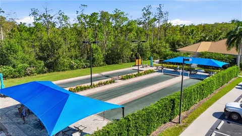 a view of a backyard with sitting area
