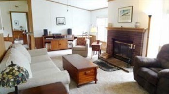 41 Pipers Way Carver, MA 02330 - Photo 5 of 36 a living room with furniture and a fireplace