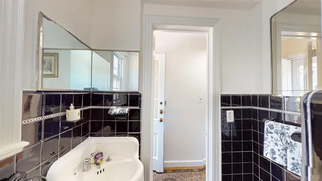 a bathroom with a bathtub and a sink
