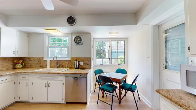a kitchen with a sink and a stove top oven