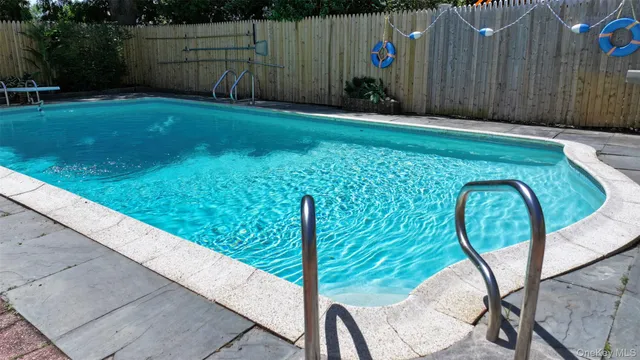 a view of swimming pool with a backyard