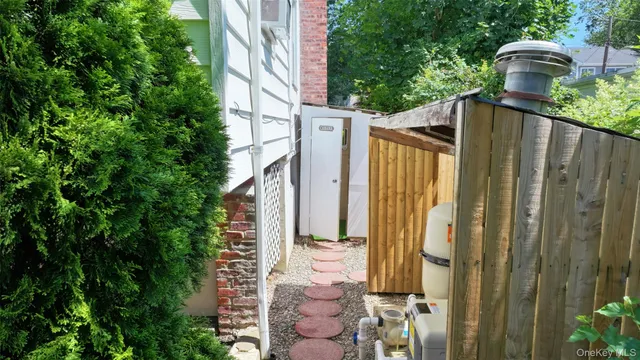 an aerial view of multiple houses with yard