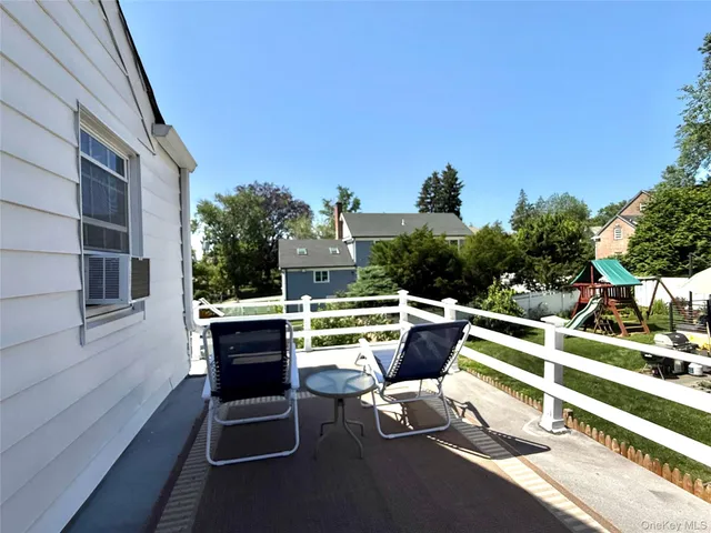 a view of a chairs in a backyard