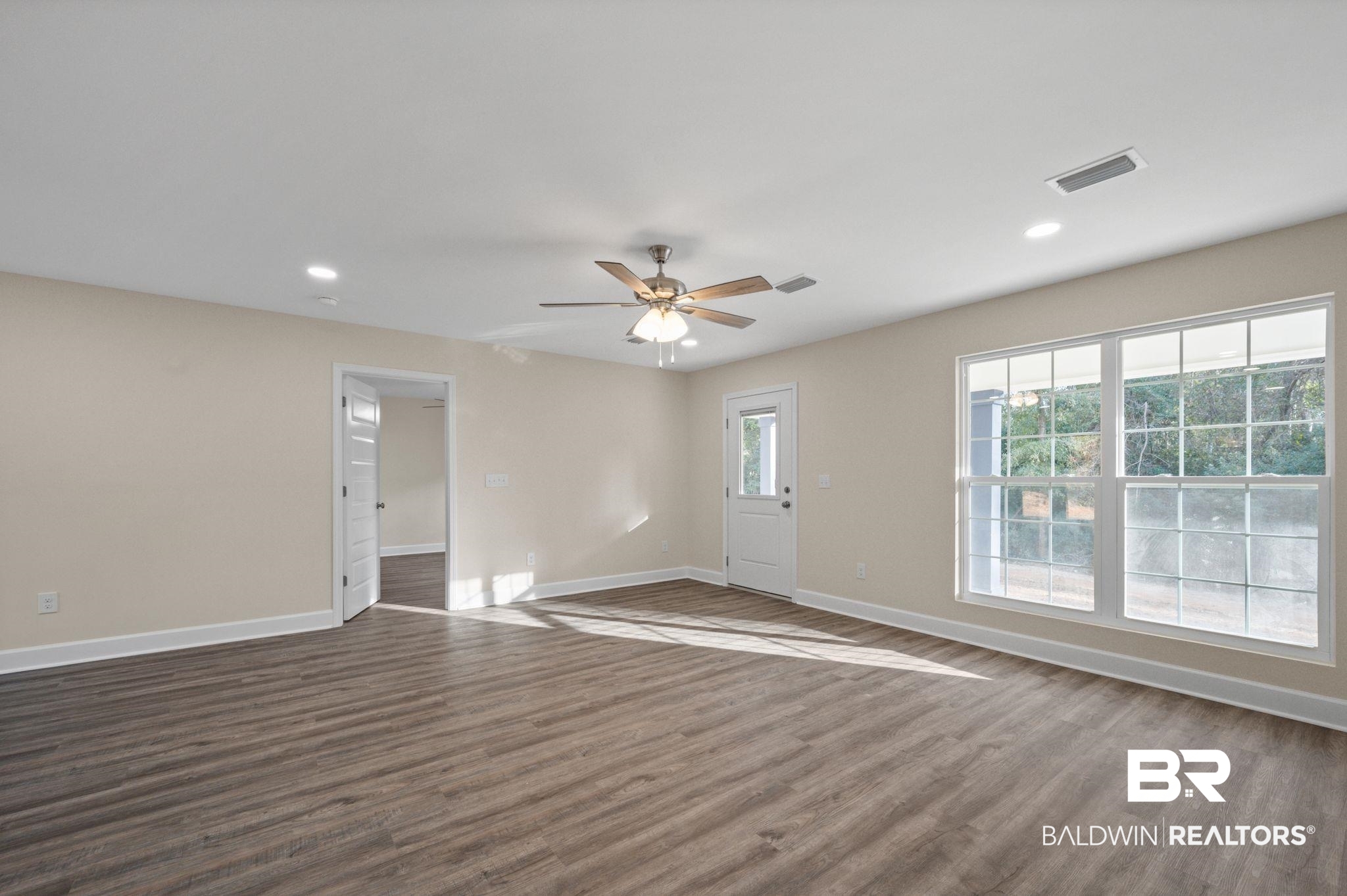 1473 Pollard Road Daphne, AL 36526 - Photo 9 of 32 Spare room with dark wood-type flooring and ceiling fan