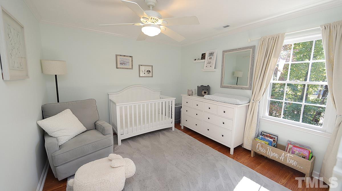 1104 Sapling Place Raleigh, NC 27615 - Photo 12 of 19 a bedroom with furniture and a window