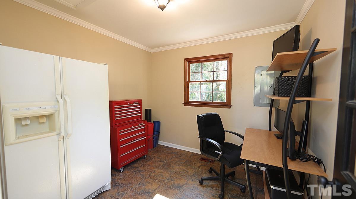 1104 Sapling Place Raleigh, NC 27615 - Photo 15 of 19 a room with furniture and a window