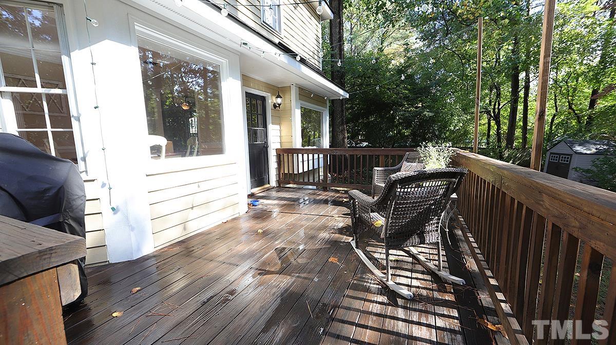 1104 Sapling Place Raleigh, NC 27615 - Photo 16 of 19 a view of a patio with table and chairs with wooden floor and fence