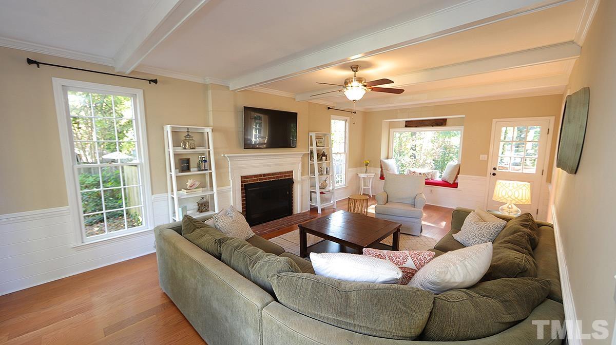 1104 Sapling Place Raleigh, NC 27615 - Photo 5 of 19 a living room with furniture fireplace and a flat screen tv