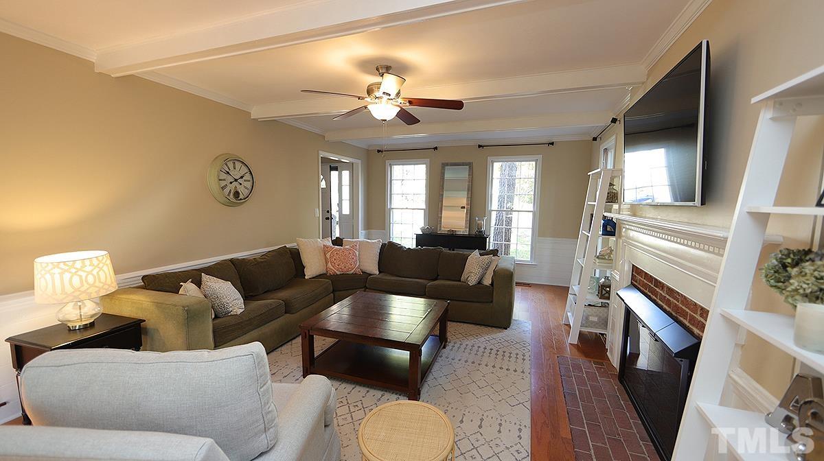 1104 Sapling Place Raleigh, NC 27615 - Photo 6 of 19 a living room with furniture and a fireplace