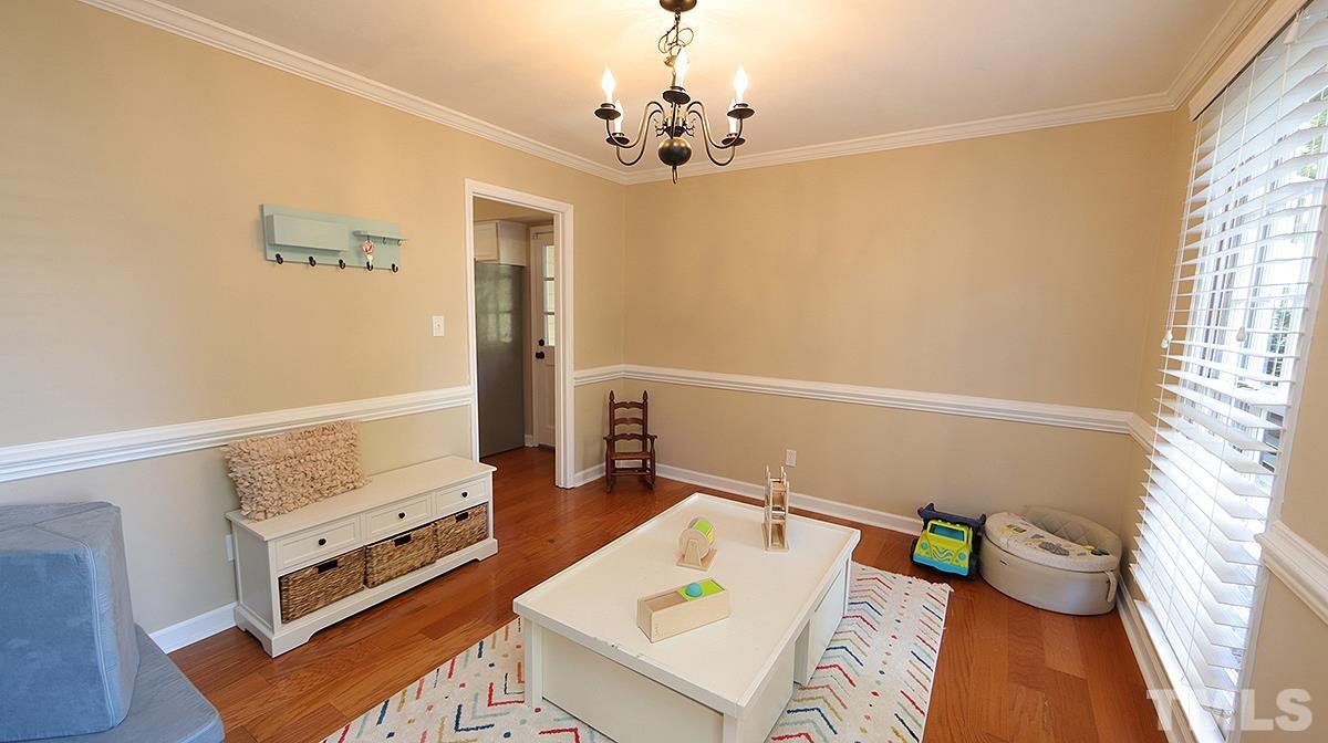 1104 Sapling Place Raleigh, NC 27615 - Photo 7 of 19 a living room with furniture and a window
