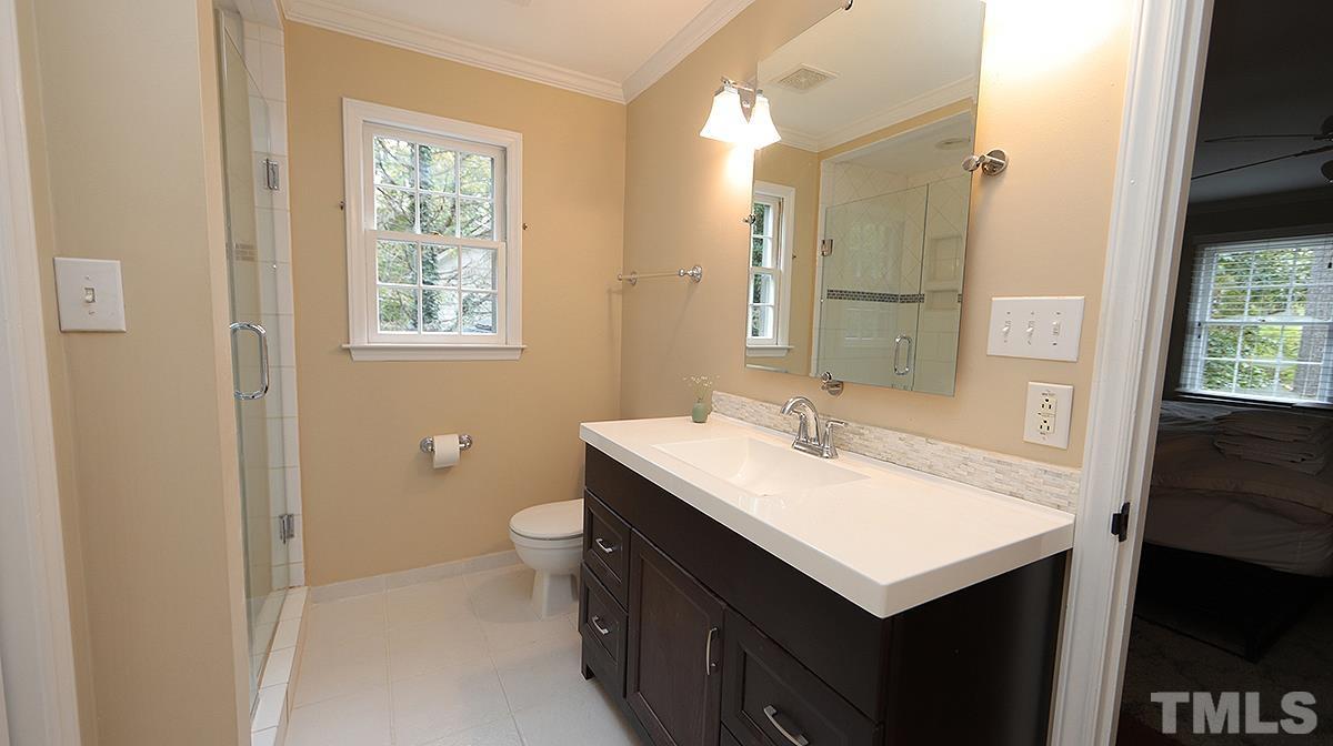 1104 Sapling Place Raleigh, NC 27615 - Photo 10 of 19 a bathroom with a sink and a mirror