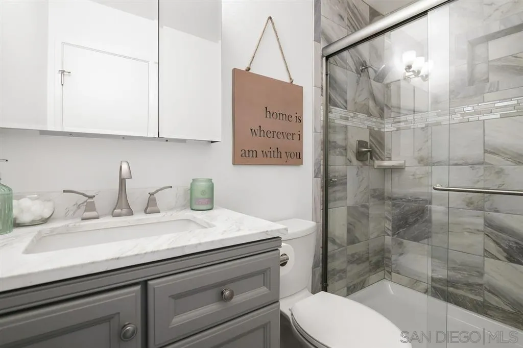 14425 Range Park Road Poway, CA 92064 - Photo 13 of 25 a bathroom with a sink a toilet and shower
