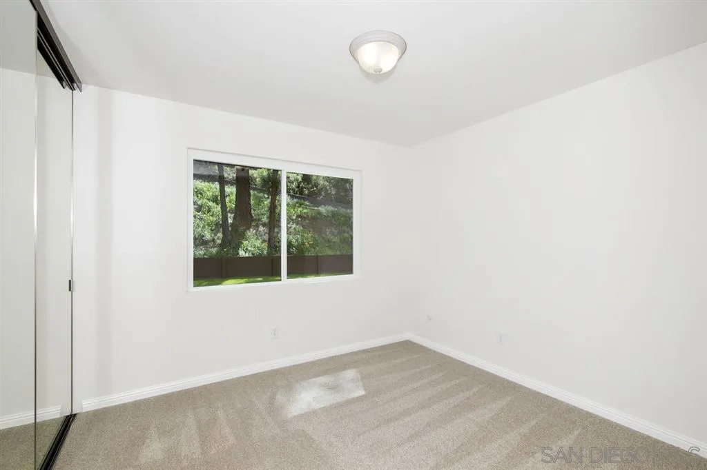 14425 Range Park Road Poway, CA 92064 - Photo 14 of 25 an empty room with a window