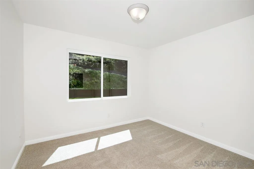 14425 Range Park Road Poway, CA 92064 - Photo 16 of 25 a view of an empty room with a window
