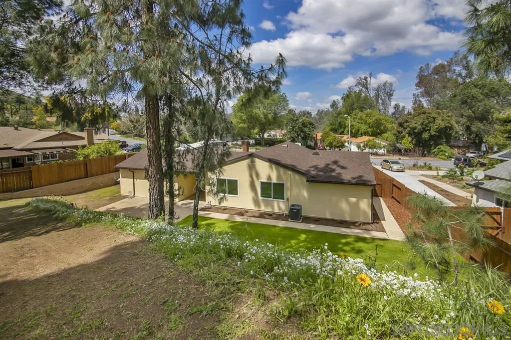 14425 Range Park Road Poway, CA 92064 - Photo 21 of 25 a view of a house with a big yard and large tree