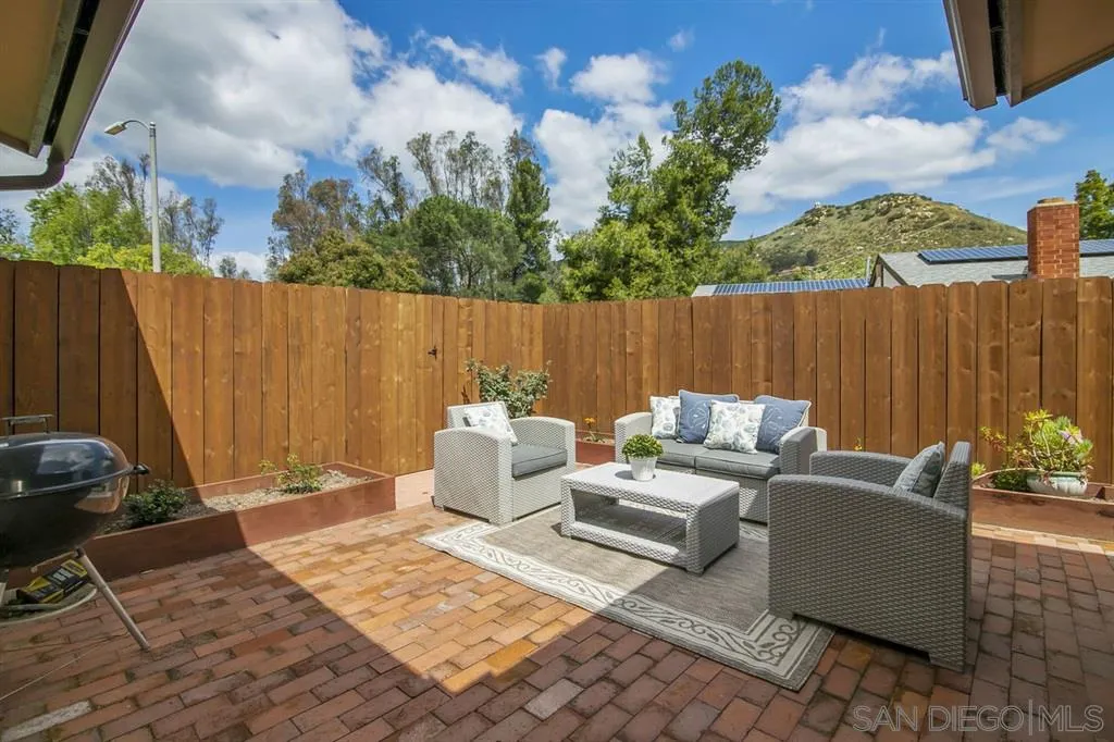 14425 Range Park Road Poway, CA 92064 - Photo 4 of 25 a view of a patio with a table and chairs