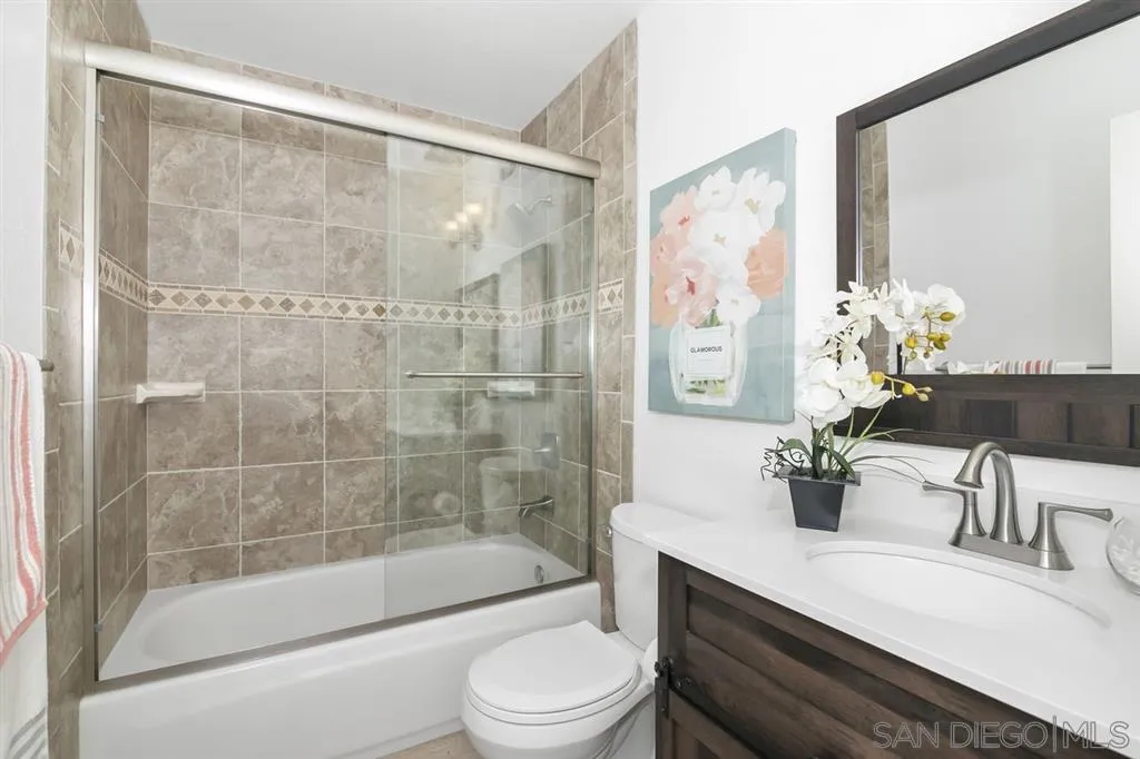 14425 Range Park Road Poway, CA 92064 - Photo 9 of 25 a bathroom with a bathtub shower sink mirror and toilet