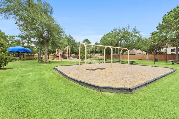 a swimming pool with outdoor seating and yard
