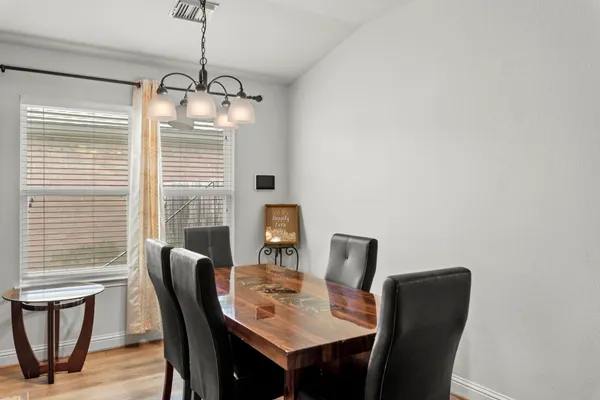 a dining room with furniture and window