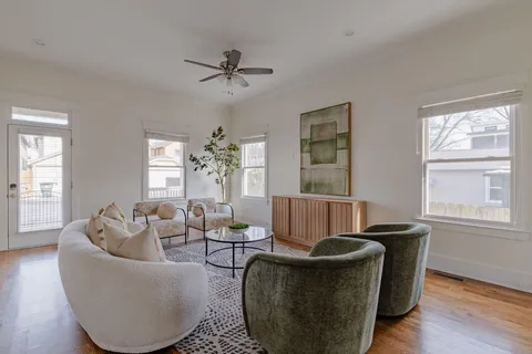 a living room with furniture and a window
