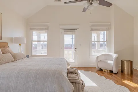 a bedroom with a bed and a chair