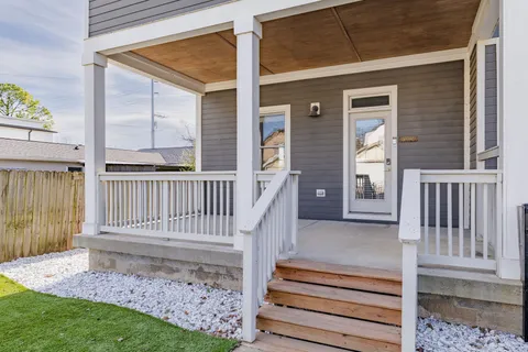 a view of a porch with a garden