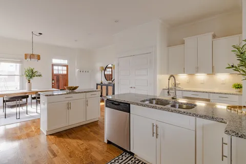 a kitchen with a sink and cabinets