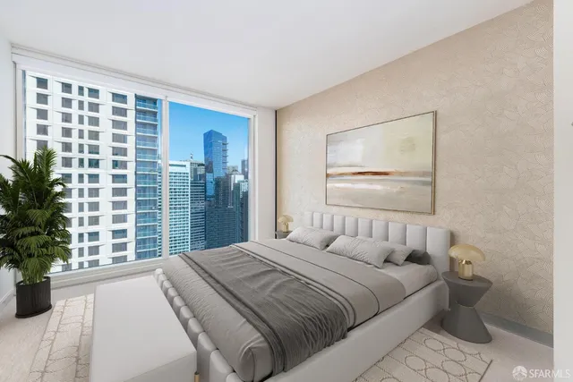 a bedroom with a large bed and a window